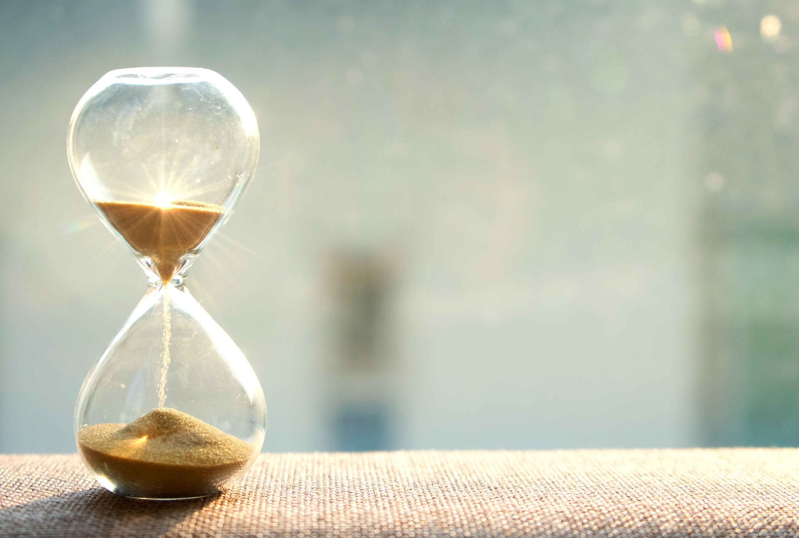An hourglass with sand inside, symbolizing do more of what matters.